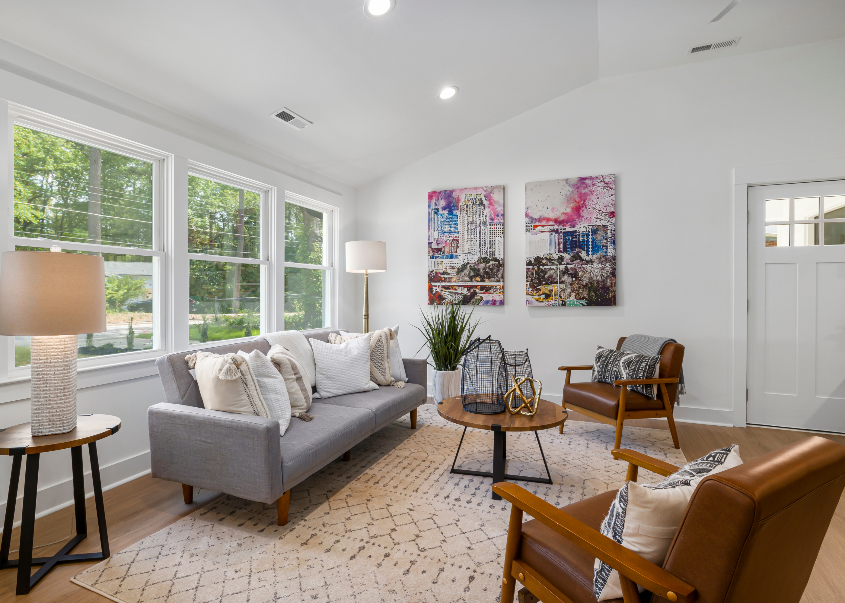 a living room with a couch and chairs